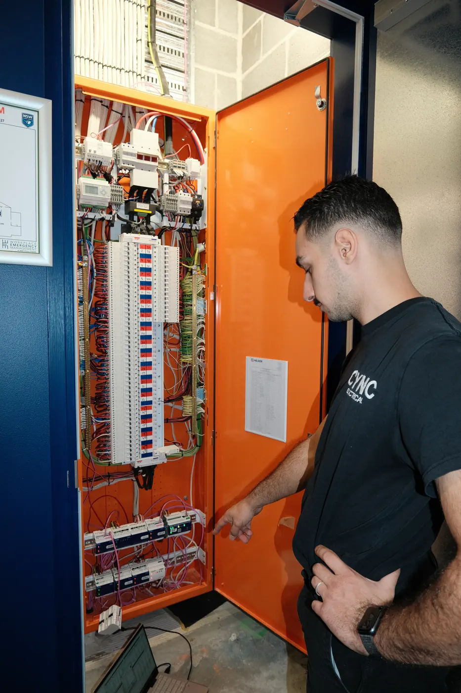 An electrician upgrading a residential switchboard