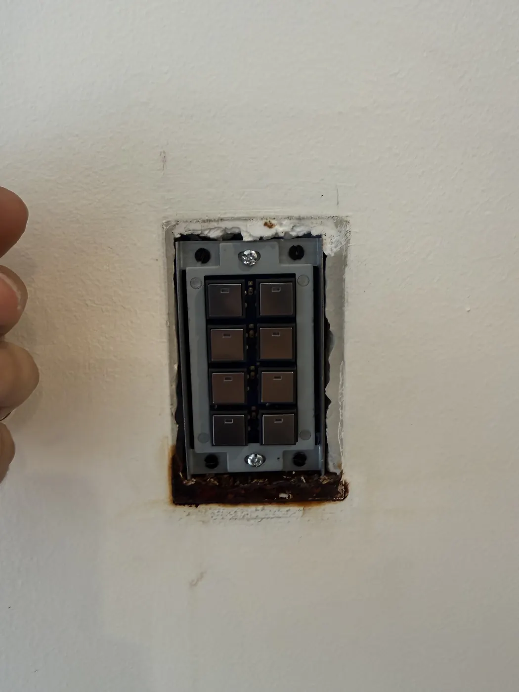 Smart lighting keypad installed in a wall