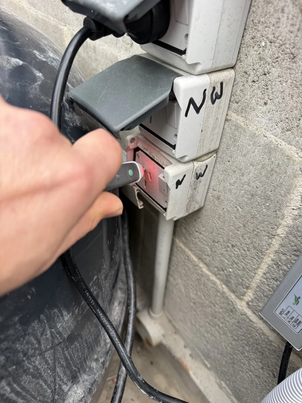 Testing a power point with a socket tester